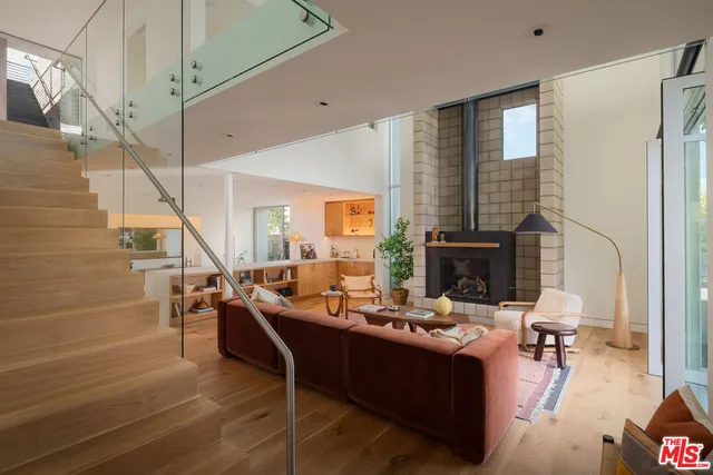 a living room with fireplace furniture and a fireplace