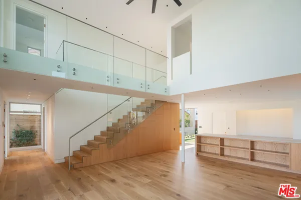 a view of an entryway with wooden floor