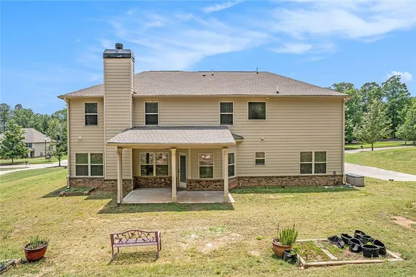 a view of a house with swimming pool