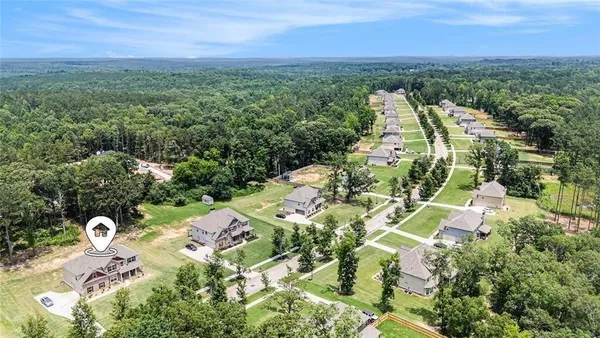 an aerial view of residential house with outdoor space