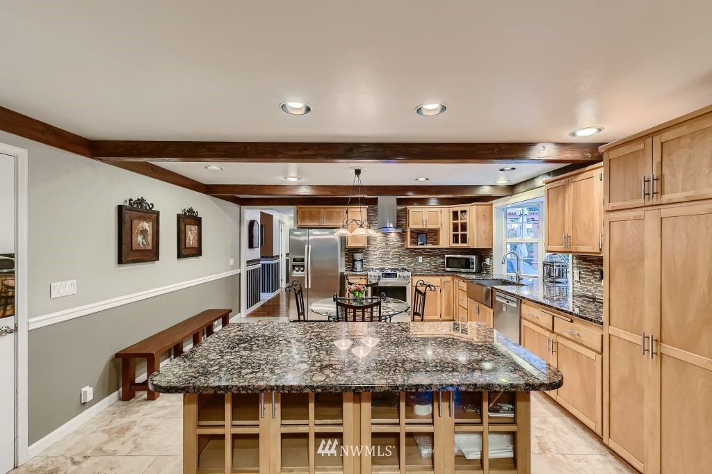32219 22nd Avenue Southwest Federal Way, WA 98023 - Photo 12 of 36 a kitchen with stainless steel appliances granite countertop a sink and cabinets