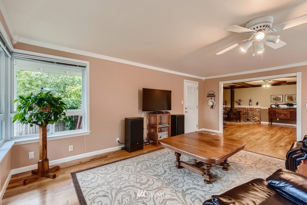 32219 22nd Avenue Southwest Federal Way, WA 98023 - Photo 20 of 36 a living room with furniture and a flat screen tv