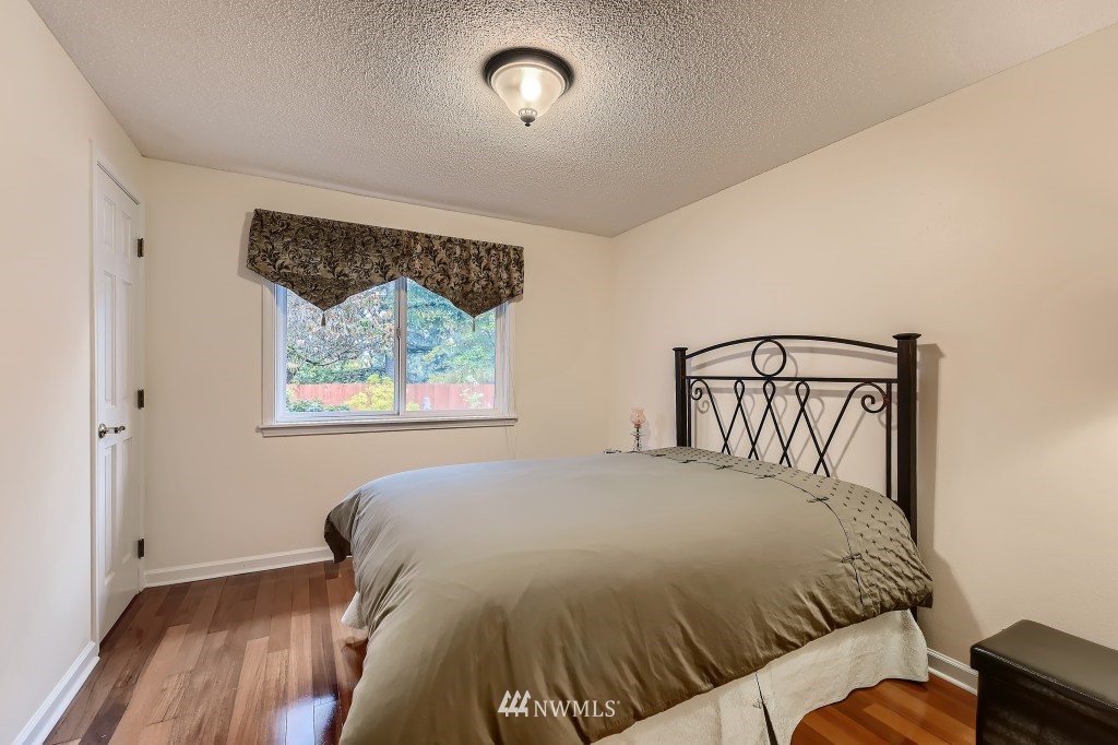 32219 22nd Avenue Southwest Federal Way, WA 98023 - Photo 28 of 36 a bedroom with a bed and a window