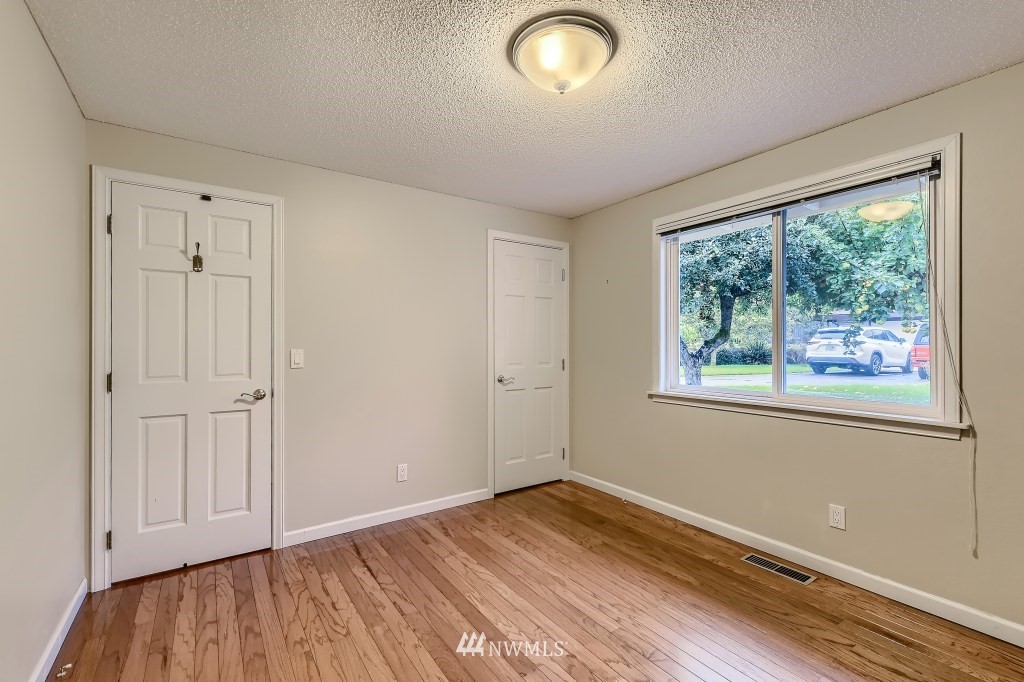 32219 22nd Avenue Southwest Federal Way, WA 98023 - Photo 30 of 36 an empty room with wooden floor and windows