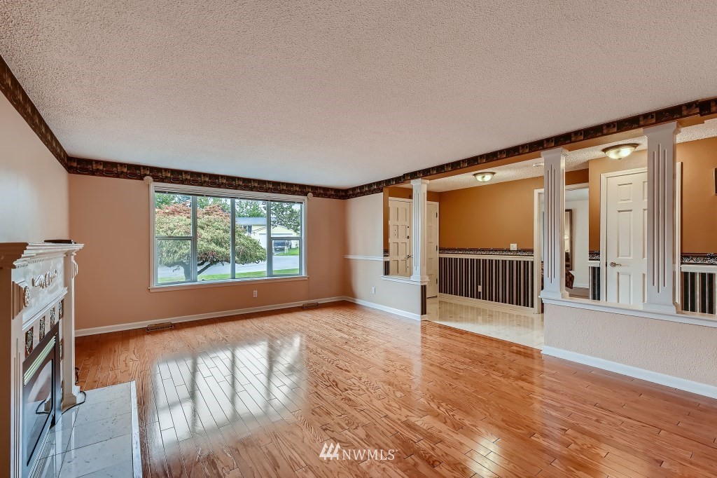 32219 22nd Avenue Southwest Federal Way, WA 98023 - Photo 7 of 36 a view of an empty room with wooden floor and a window
