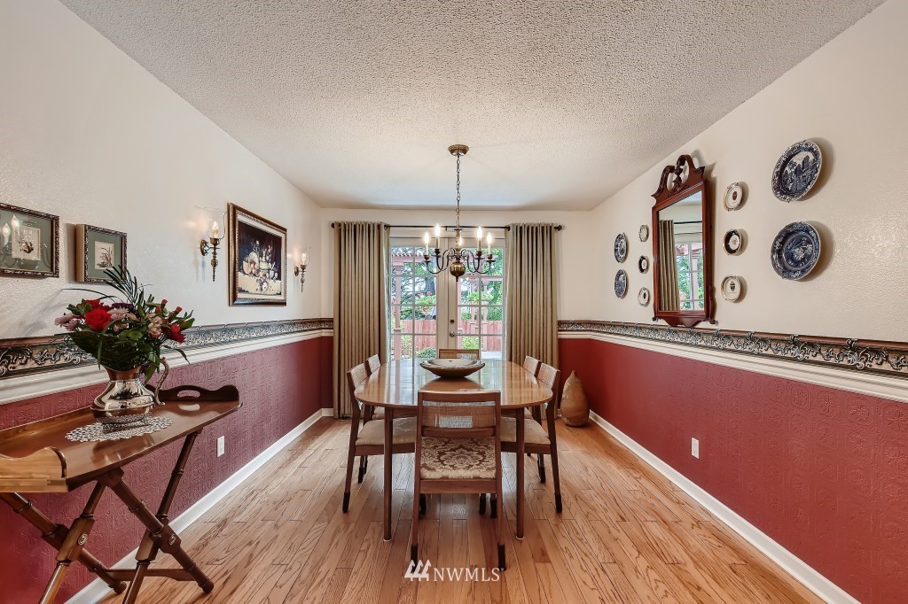 32219 22nd Avenue Southwest Federal Way, WA 98023 - Photo 8 of 36 a view of a dining room with furniture window and wooden floor