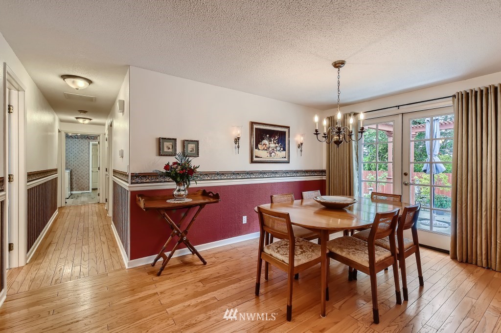 32219 22nd Avenue Southwest Federal Way, WA 98023 - Photo 9 of 36 a view of a dining room with furniture window and wooden floor