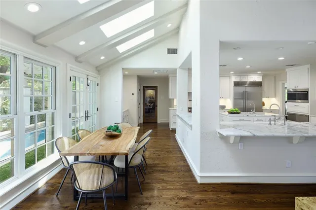 a living room with fireplace furniture and a wooden floor