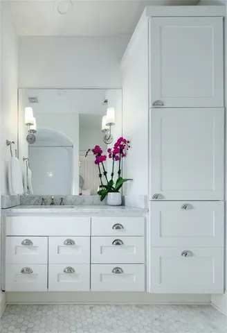 a bedroom with bed and a large window