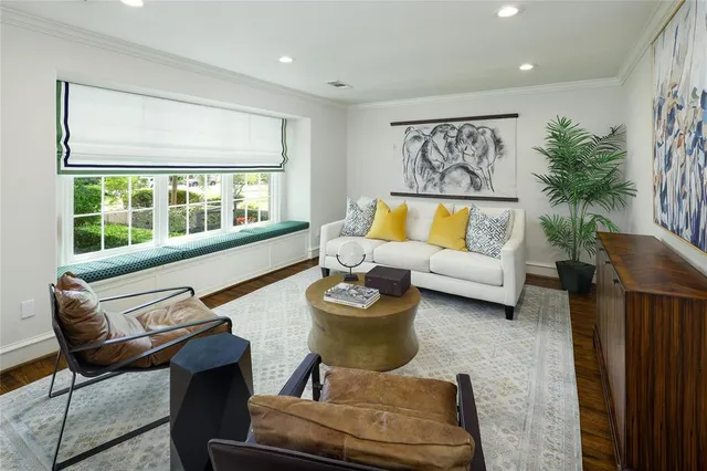 a bathroom with a granite countertop sink mirror and window