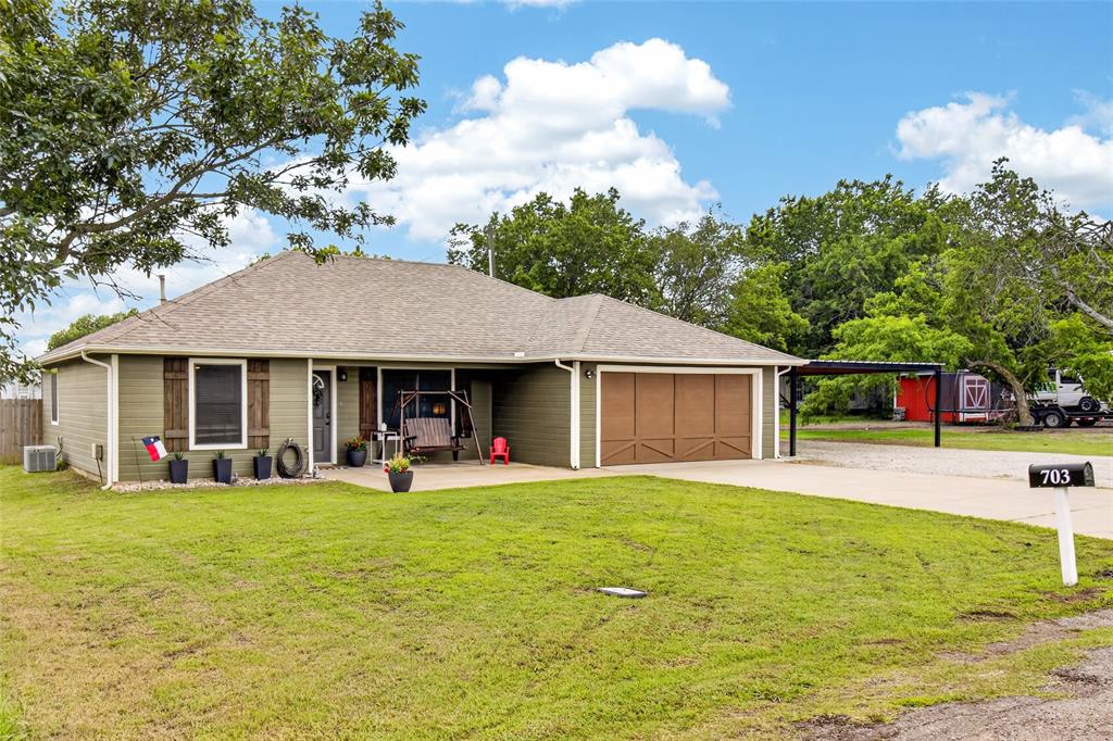 703 College Street Celeste, TX 75423 - Photo 5 of 29 a view of a house with a yard and sitting area