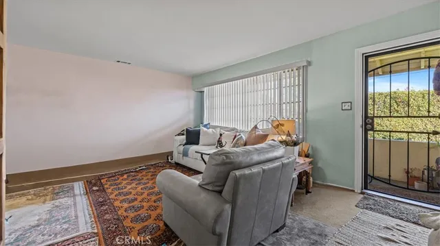 a bed room with furniture and a window