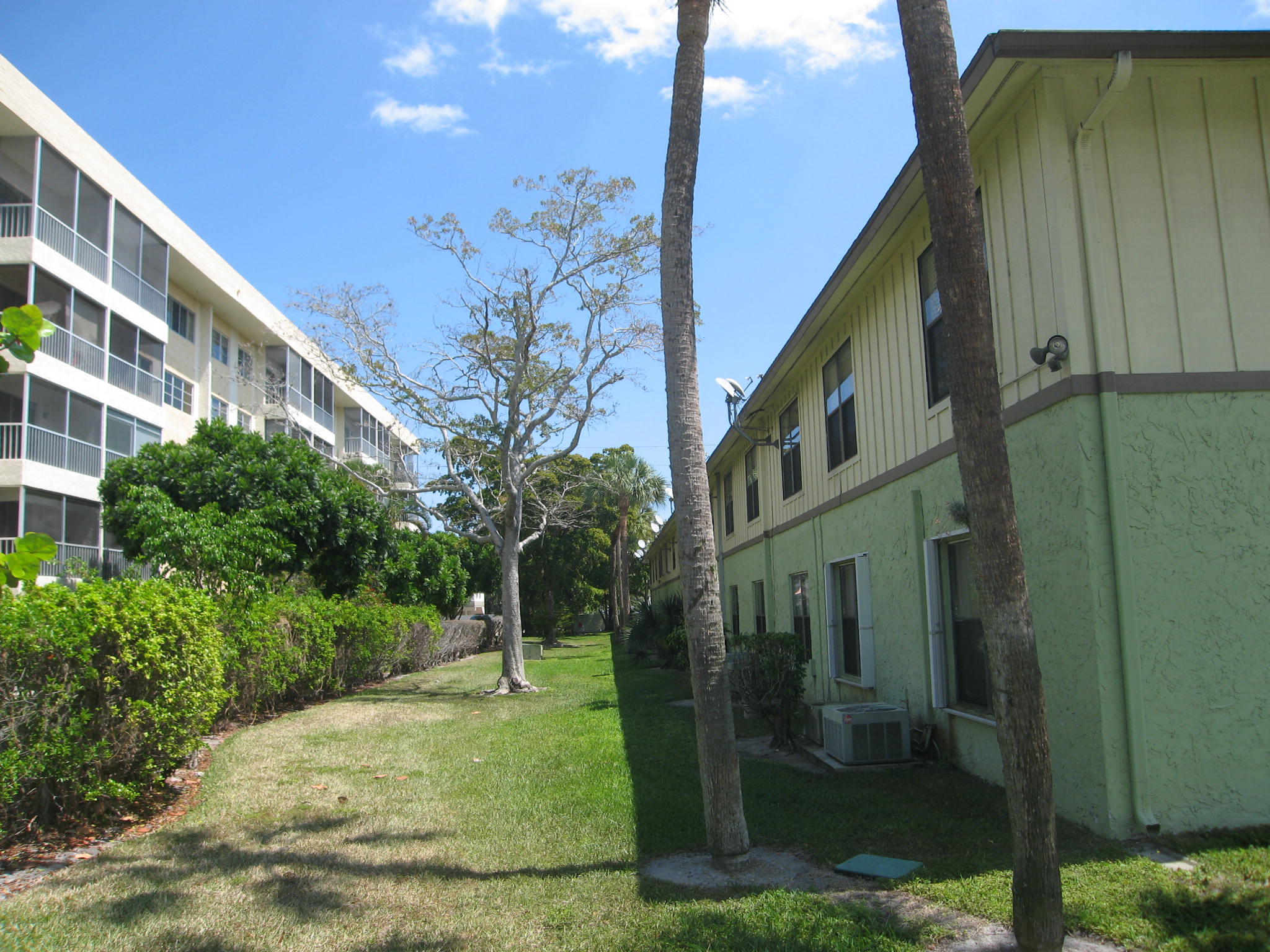 201 Southwest 1st Street, Unit 8 Boca Raton, FL 33432 - Photo 27 of 27 a view of a house with a yard
