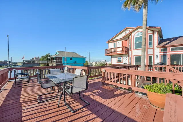 a front view of a house with a deck