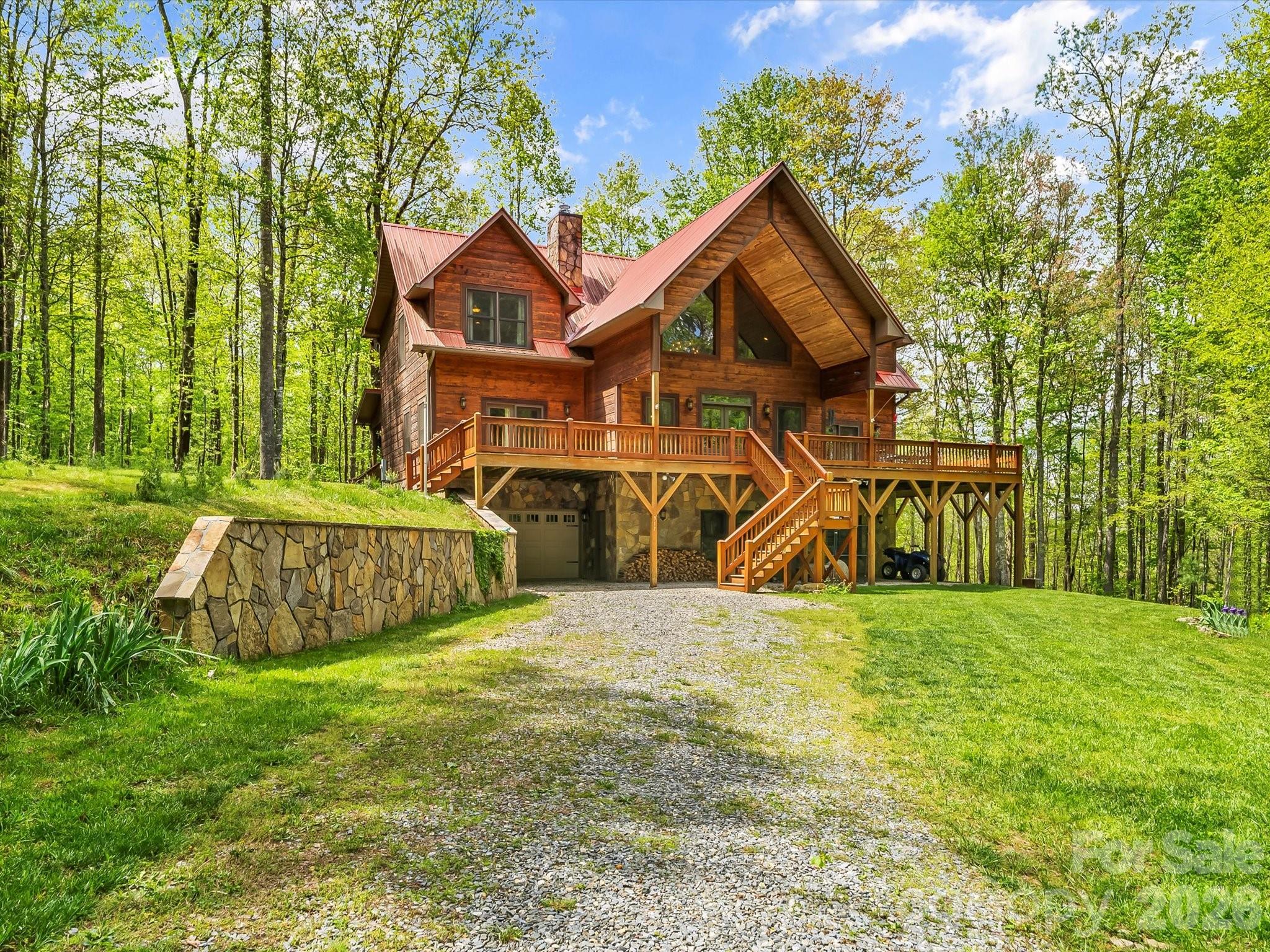 917 Otter Mountain Road Topton, NC 28781 - Photo 3 of 48 a view of a house with backyard and a tree