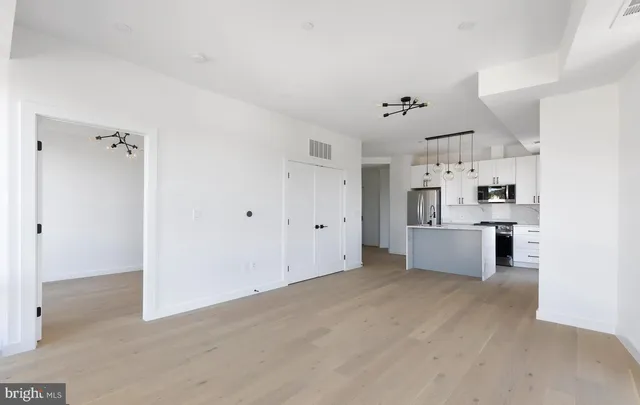 a view of kitchen with wooden floor