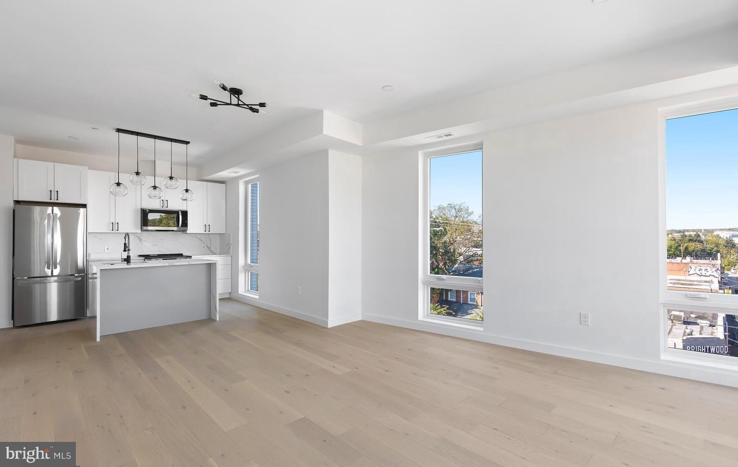 30 Kennedy Street Northwest, Unit 14 Washington, DC 20011 - Photo 18 of 40 a kitchen with stainless steel appliances a refrigerator and a window