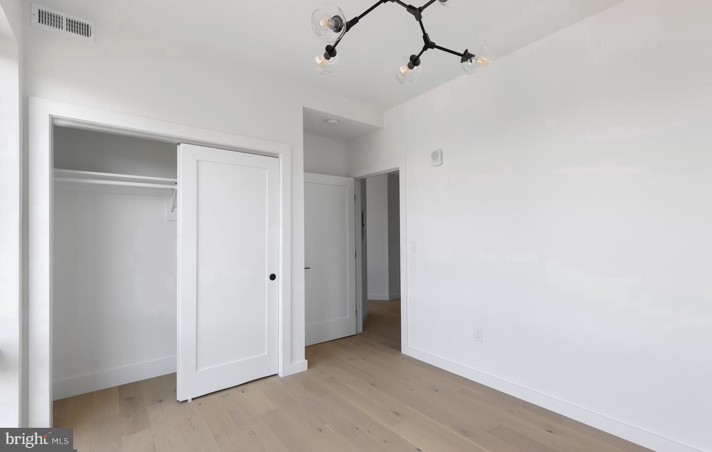 30 Kennedy Street Northwest, Unit 14 Washington, DC 20011 - Photo 32 of 40 a view of a room with rack and chandelier