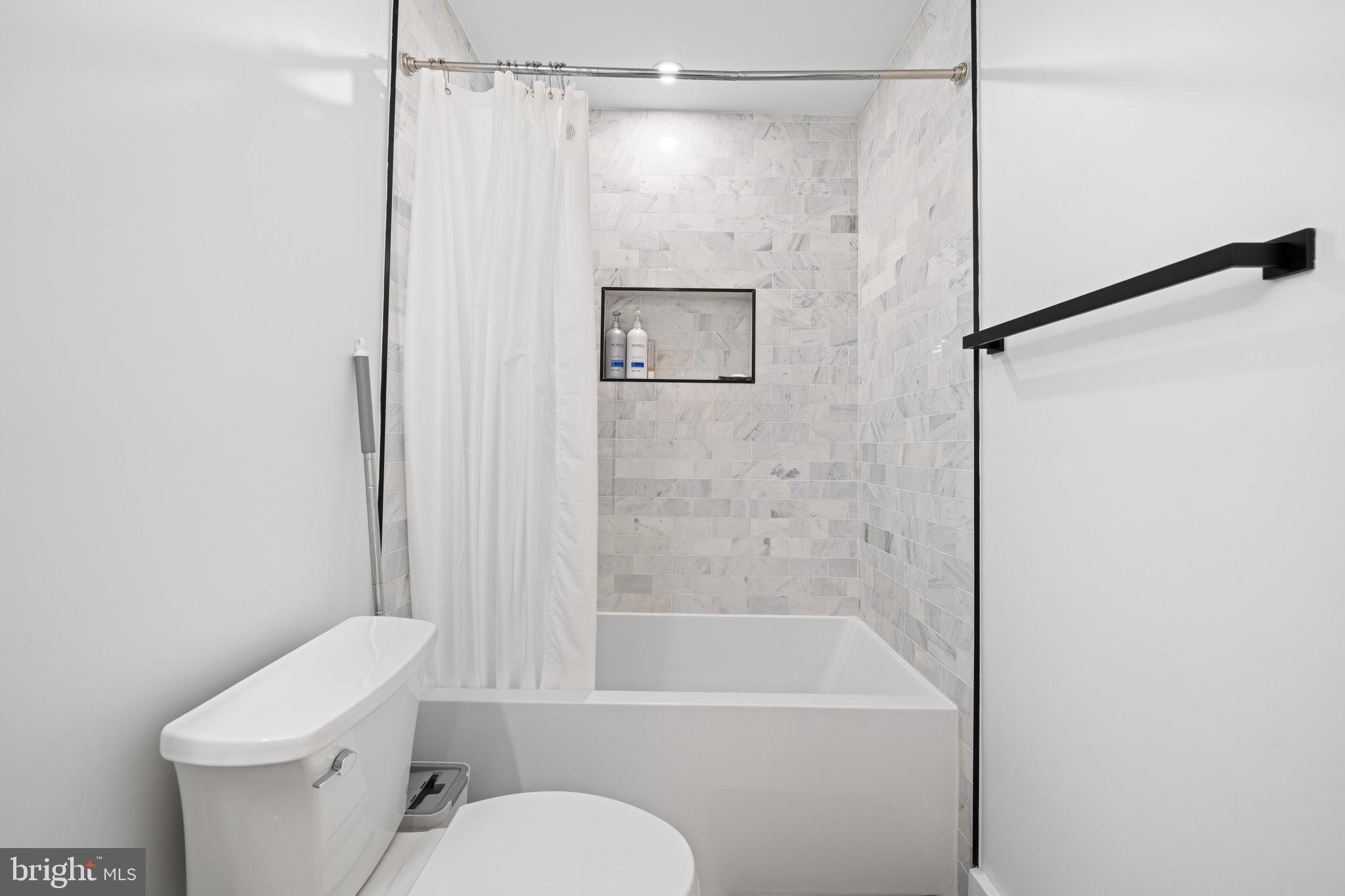 30 Kennedy Street Northwest, Unit 14 Washington, DC 20011 - Photo 34 of 40 a bathroom with a shower a toilet and a sink