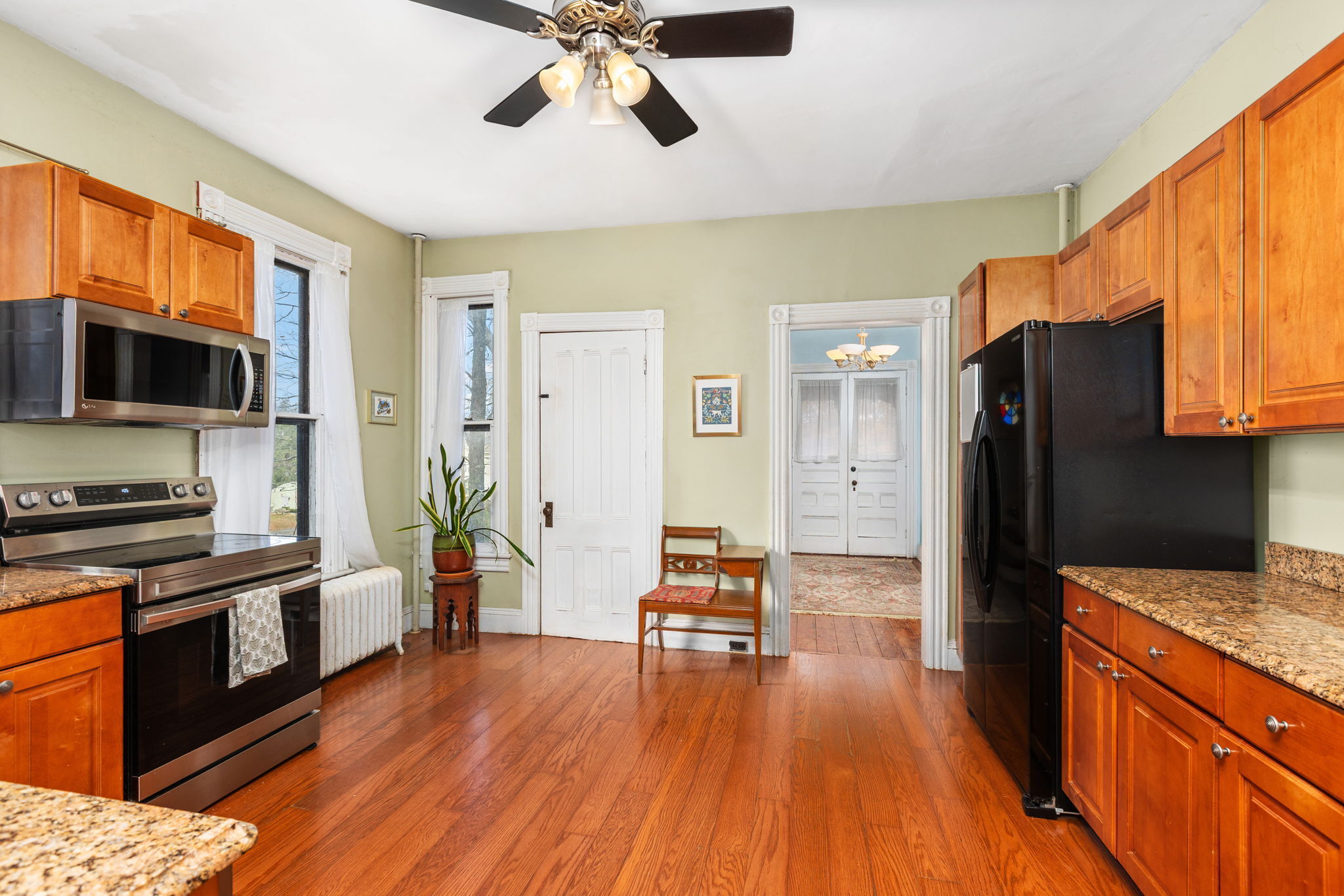 9 Mountainville Road Danbury, CT 06810 - Photo 12 of 36 a kitchen with stainless steel appliances granite countertop a refrigerator stove top oven and cabinets
