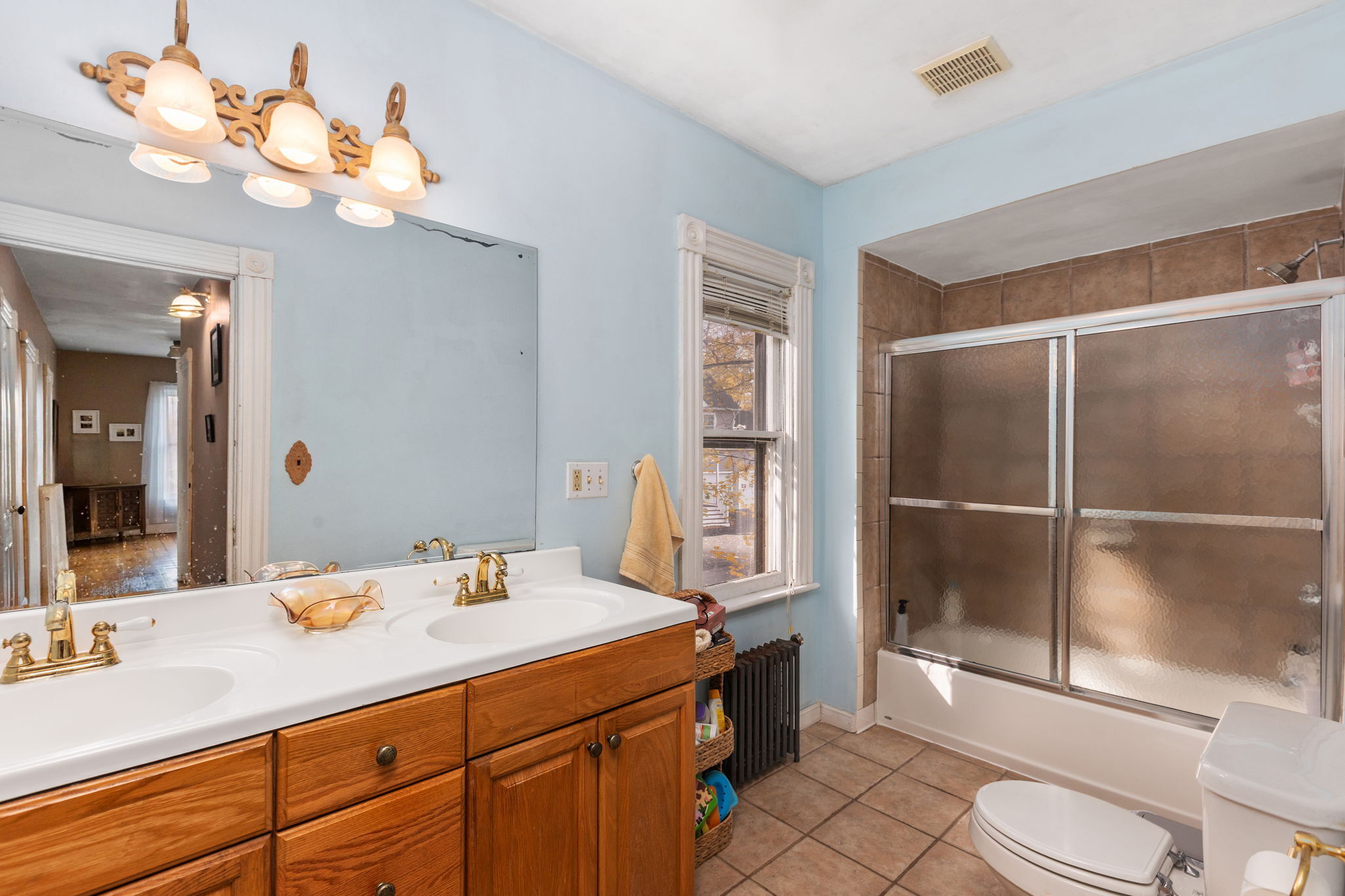 9 Mountainville Road Danbury, CT 06810 - Photo 20 of 36 a bathroom with a sink a toilet and shower