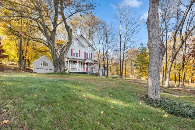 a sign board with yard in front of it
