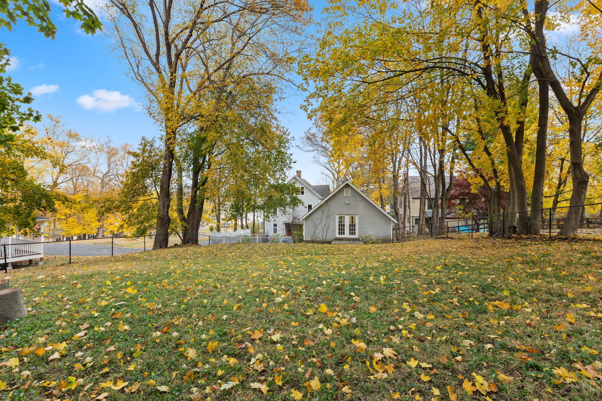 9 Mountainville Road Danbury, CT 06810 - Photo 31 of 36 a big room with large trees and barn in the background