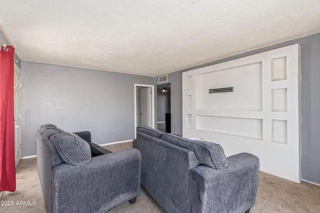 a living room with furniture and a window