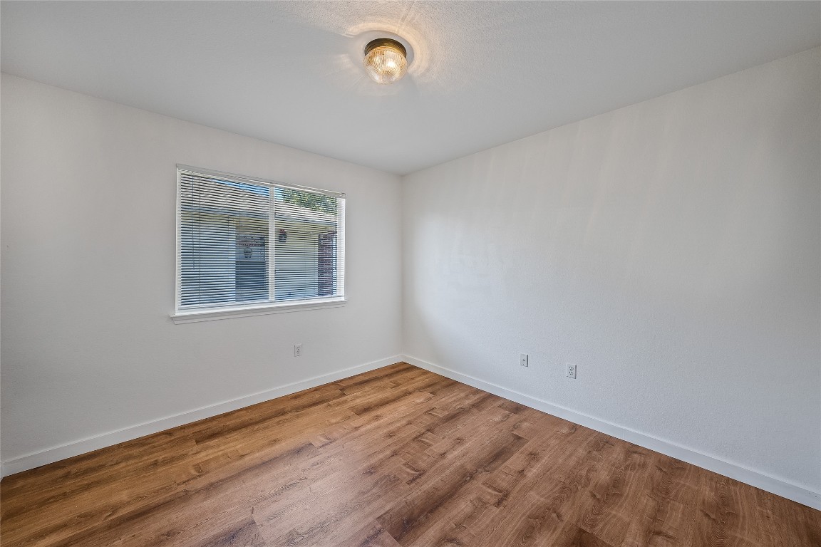 12517 Campana Drive Del Valle, TX 78617 - Photo 12 of 15 an empty room with a window