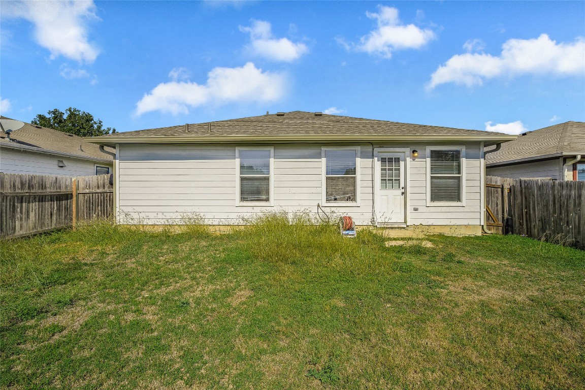 12517 Campana Drive Del Valle, TX 78617 - Photo 14 of 15 a front view of a house with a garden