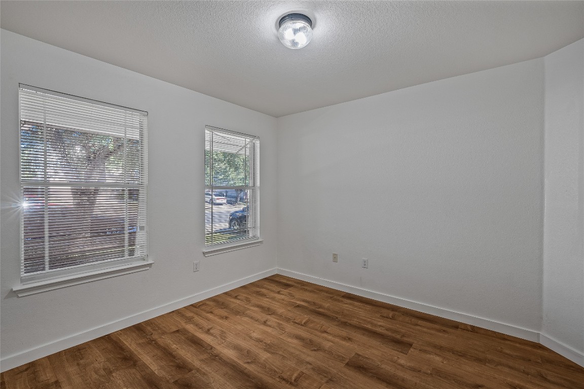 12517 Campana Drive Del Valle, TX 78617 - Photo 8 of 15 a view of empty room with wooden floor and fan