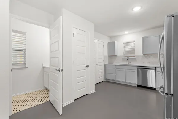 a bathroom with a sink and a mirror