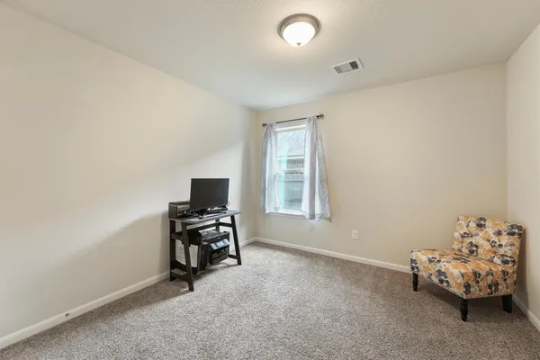 a workspace with furniture and window