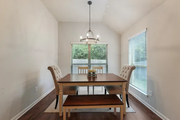 a dining room with furniture and window