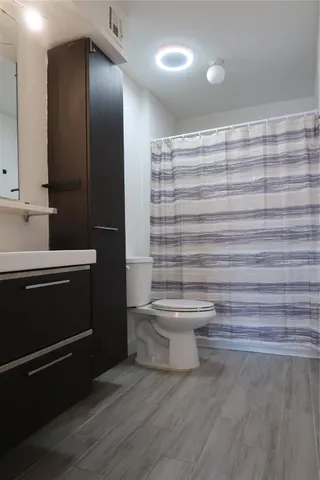 a backyard of a house with chairs