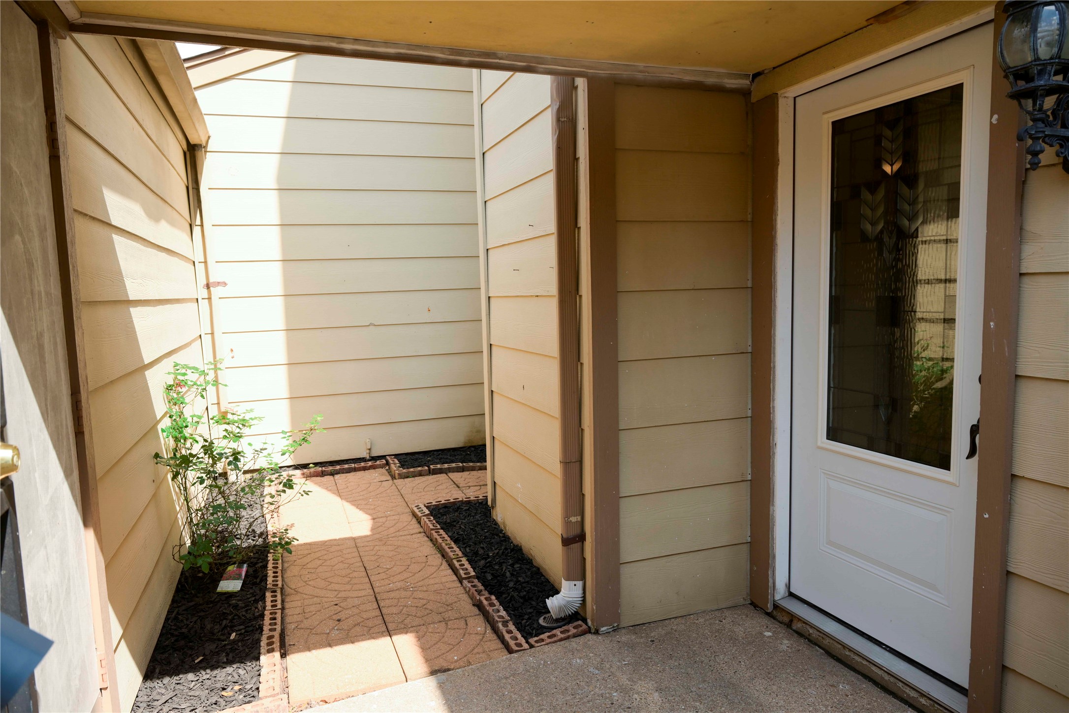 14209 Briarsage Court, Unit TH15 Houston, TX 77077 - Photo 2 of 31 a view of entry way with wooden door