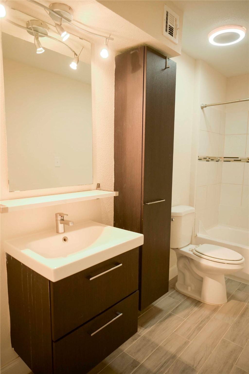 14209 Briarsage Court, Unit TH15 Houston, TX 77077 - Photo 21 of 31 a bathroom with a sink toilet and shower