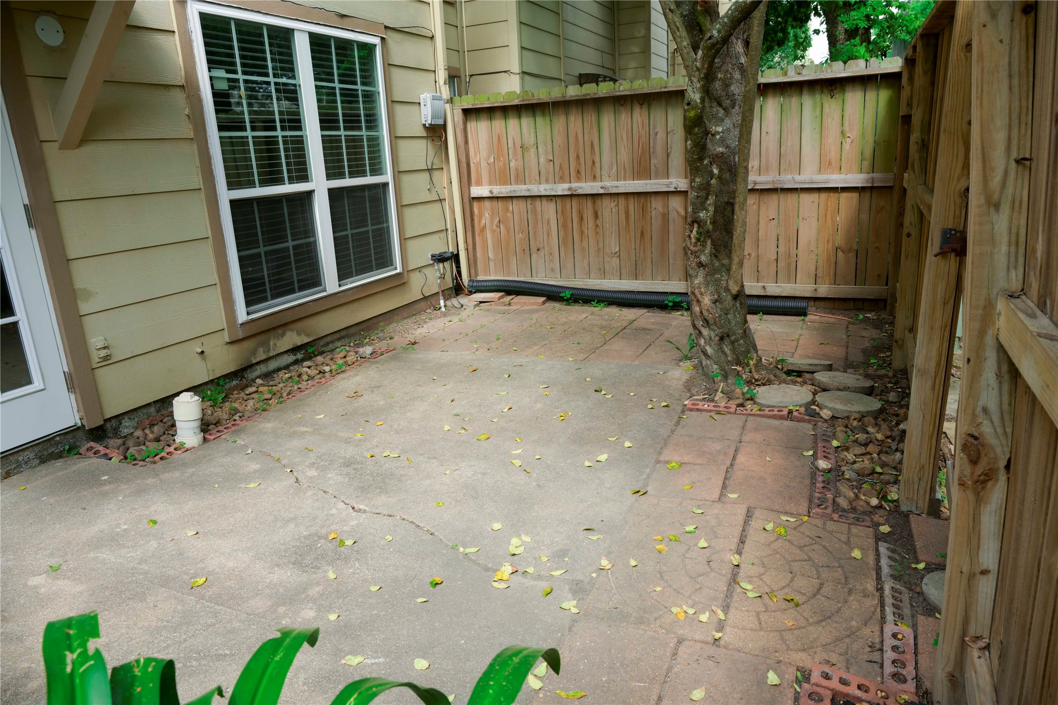 14209 Briarsage Court, Unit TH15 Houston, TX 77077 - Photo 25 of 31 a view of a backyard