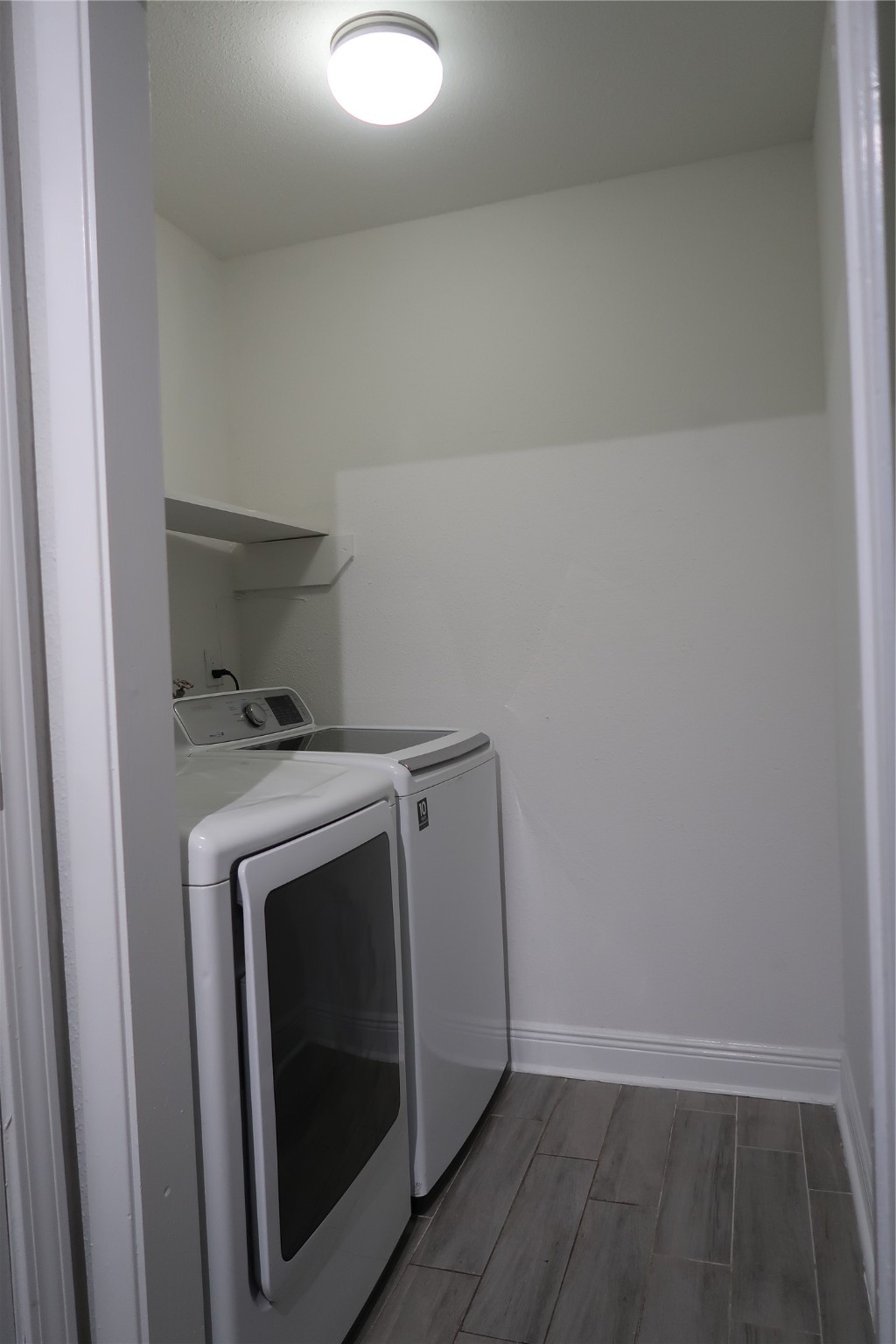 14209 Briarsage Court, Unit TH15 Houston, TX 77077 - Photo 9 of 31 a utility room with dryer and washer