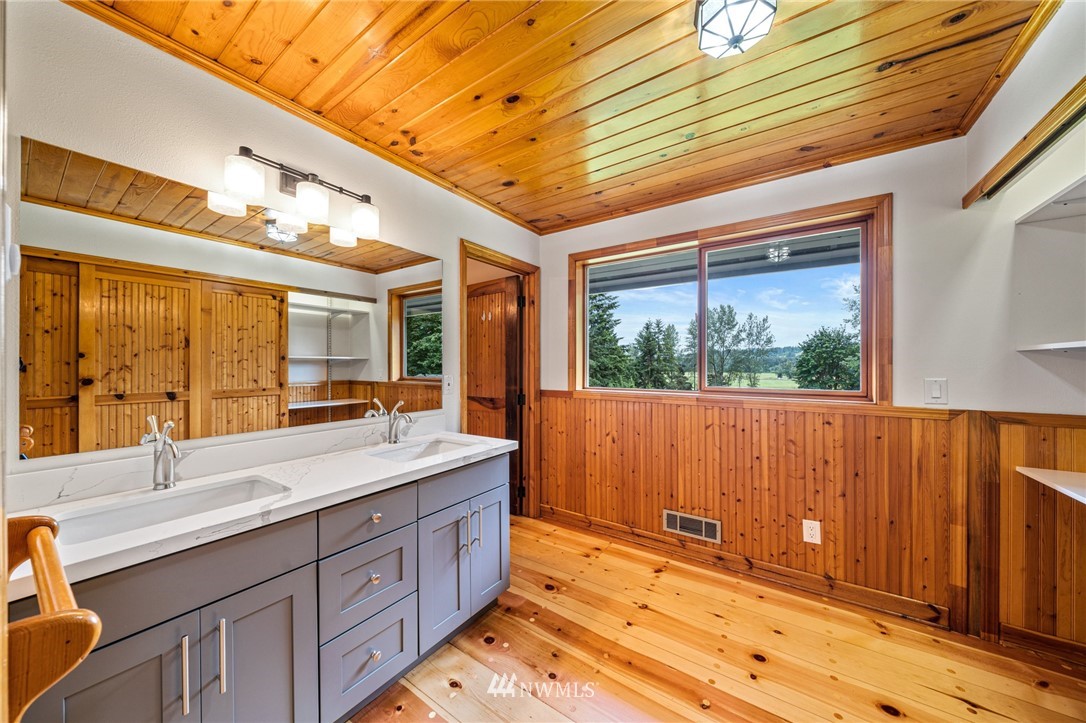 15819 Tester Road Snohomish, WA 98290 - Photo 22 of 33 a spacious bathroom with a sink double vanity granite and a large window