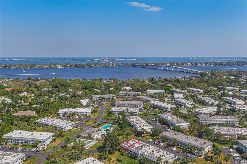 2929 Southeast Ocean Boulevard, Unit 1436 Stuart, FL 34996 - Photo 1 of 18 an aerial view of a city with lots of residential buildings