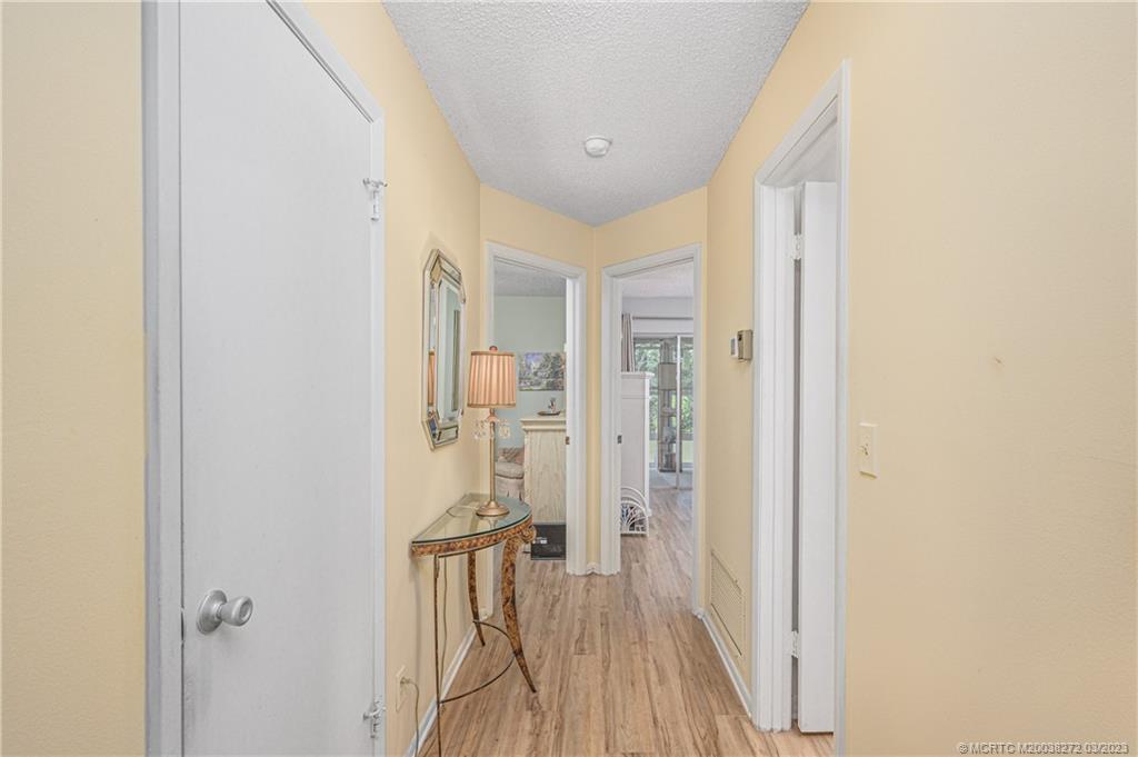 2929 Southeast Ocean Boulevard, Unit 1436 Stuart, FL 34996 - Photo 8 of 18 a bathroom with a glass shower door