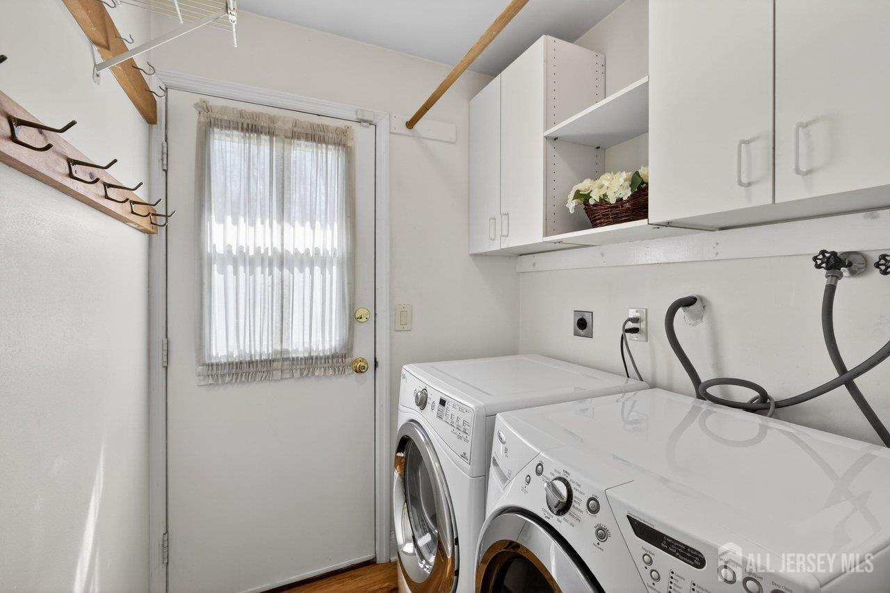 15 Cherokee Road East Brunswick, NJ 08816 - Photo 16 of 45 a utility room with dryer and washer