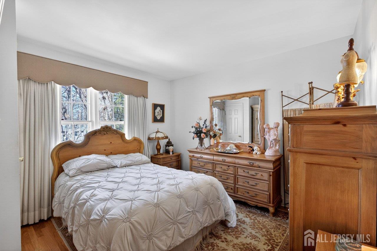 15 Cherokee Road East Brunswick, NJ 08816 - Photo 29 of 45 a bedroom with a bed and a dresser