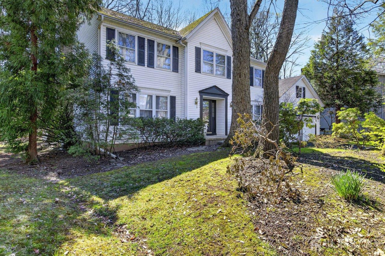15 Cherokee Road East Brunswick, NJ 08816 - Photo 3 of 45 a view of house in front of a yard with potted plants and large trees