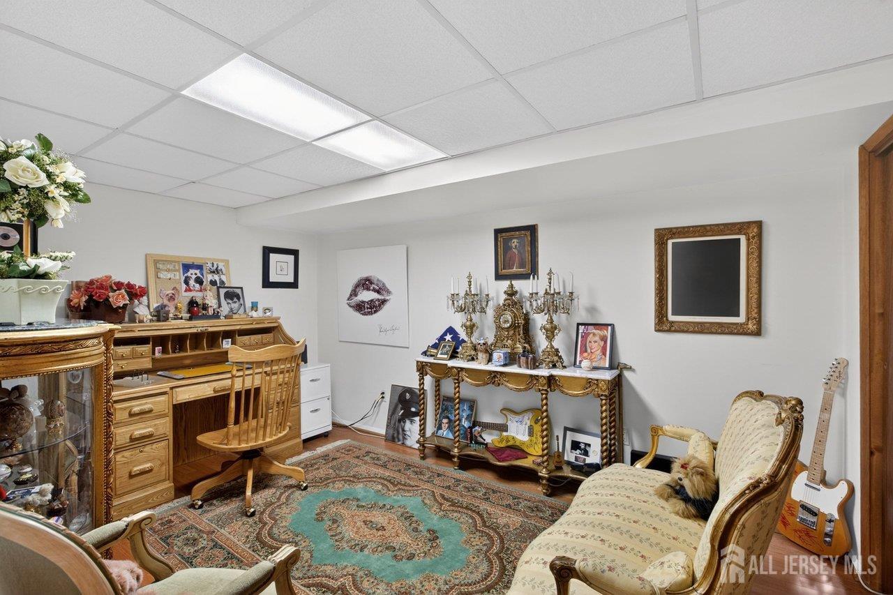 15 Cherokee Road East Brunswick, NJ 08816 - Photo 34 of 45 a view of a workspace with furniture and toys