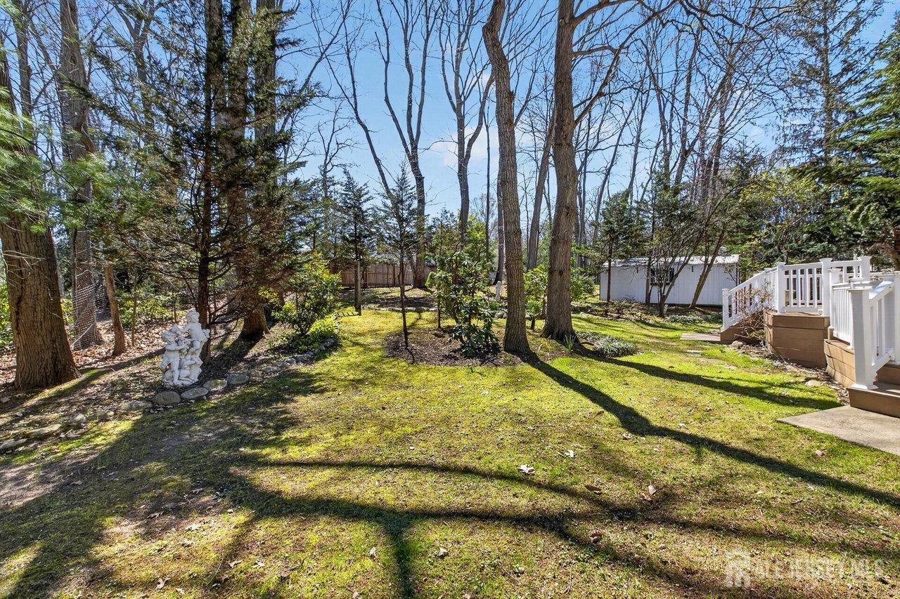 15 Cherokee Road East Brunswick, NJ 08816 - Photo 41 of 45 a view of a yard with swimming pool
