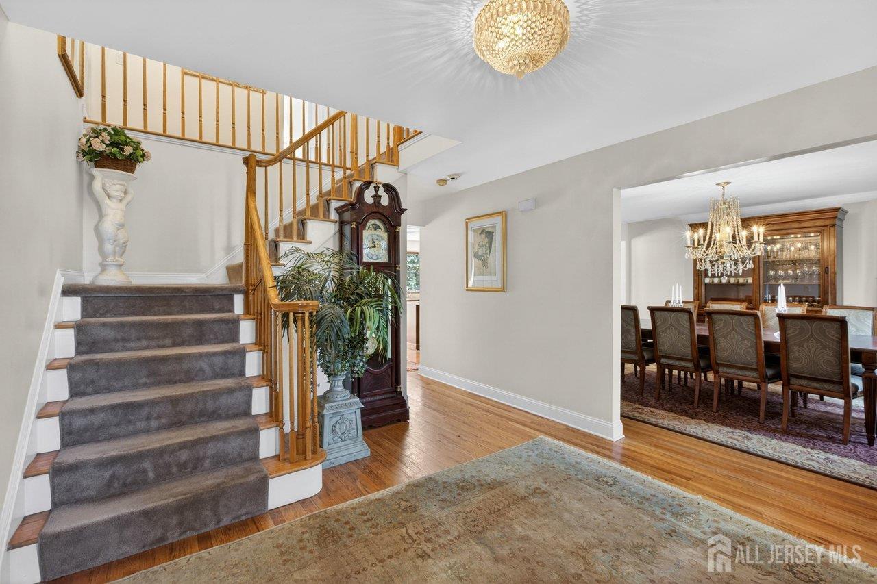 15 Cherokee Road East Brunswick, NJ 08816 - Photo 5 of 45 a view of entryway and hall with wooden floor
