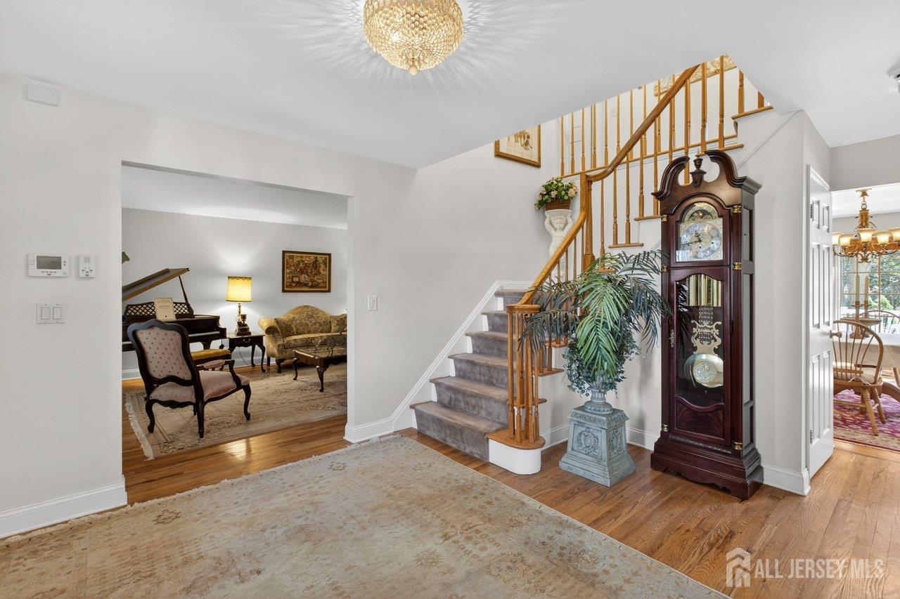 15 Cherokee Road East Brunswick, NJ 08816 - Photo 6 of 45 a view of entryway livingroom and hall