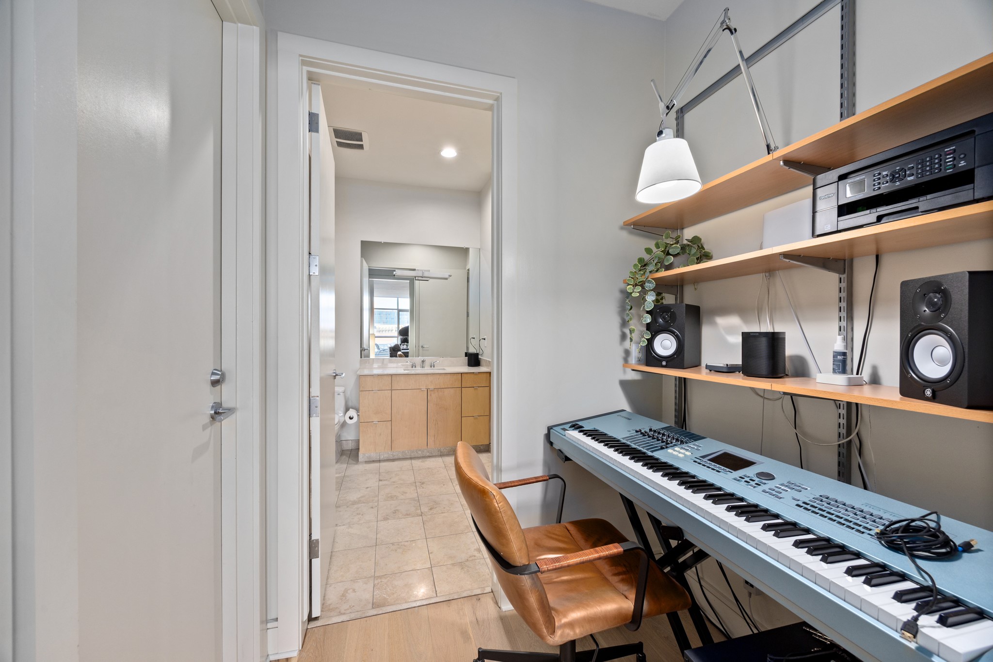 555 East 5th Street, Unit 521 Austin, TX 78701 - Photo 25 of 37 a room with furniture and a piano